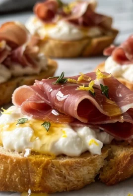 Beef Prosciutto Crostini with Burrata and Lemon Honey Drizzle